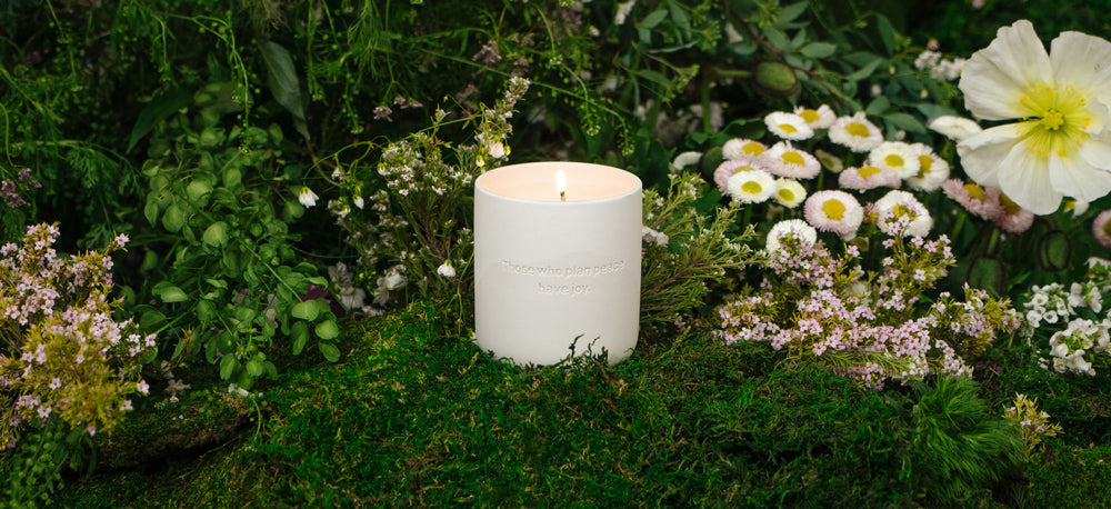 Peace candle in a mossy setting