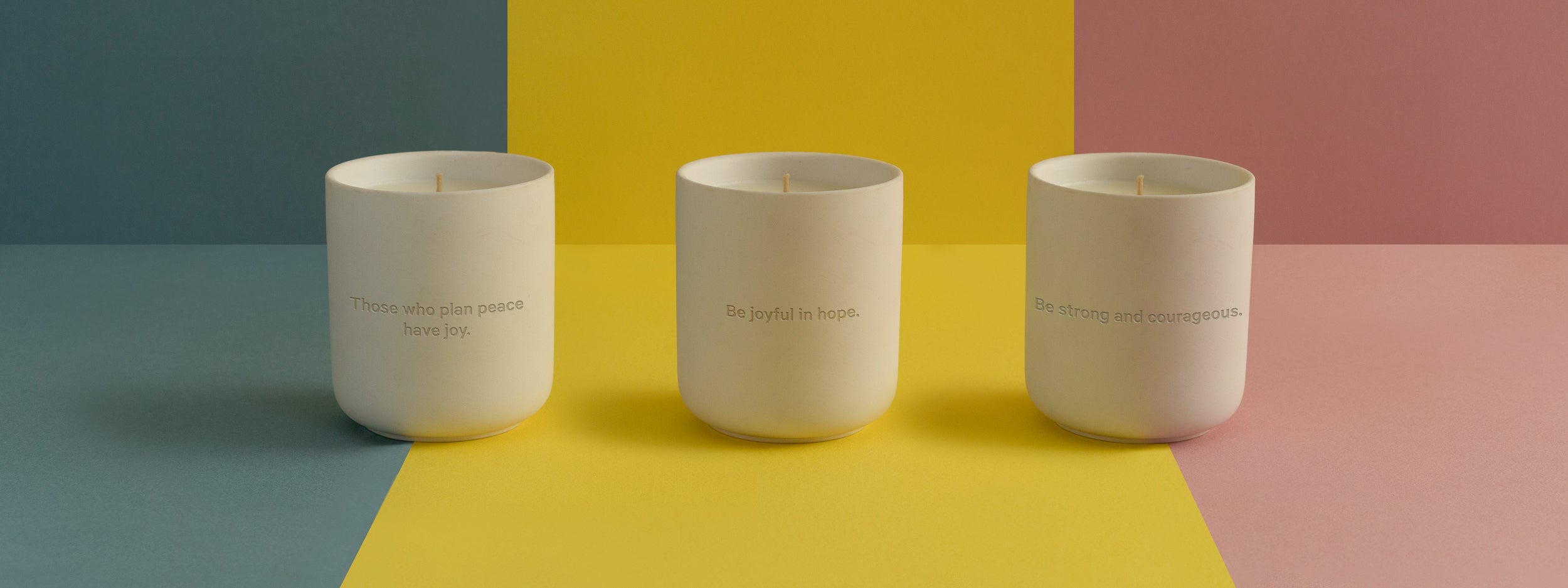 Three Candles on blue yellow and red background