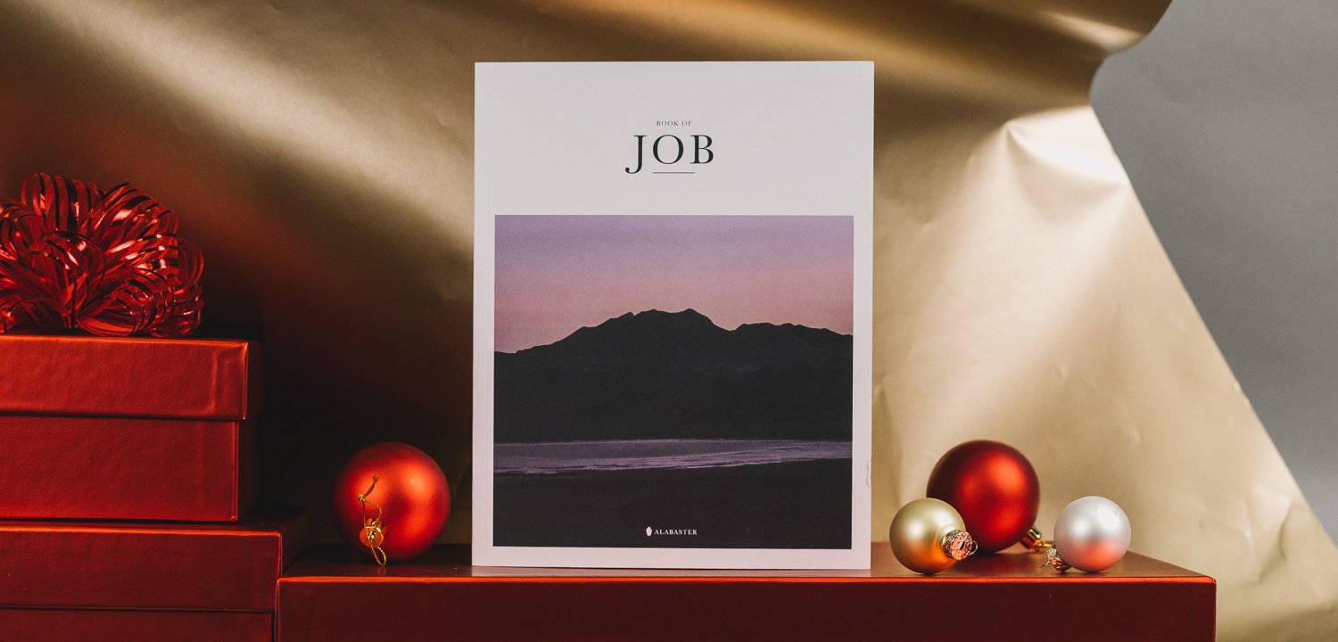 The Book of Job with Christmas wrapping paper and ornaments