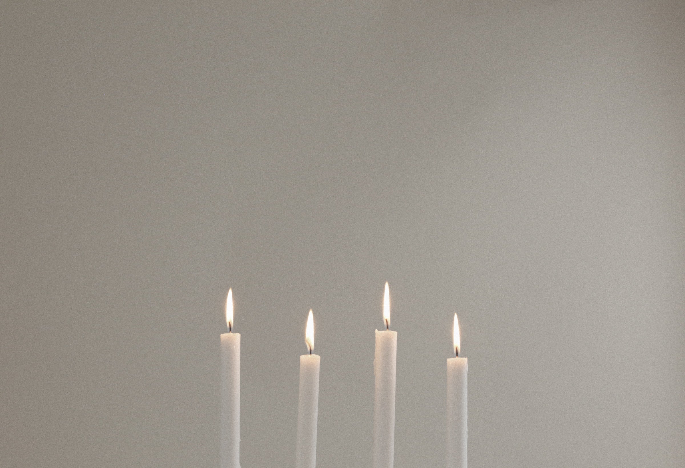 Lit taper candle