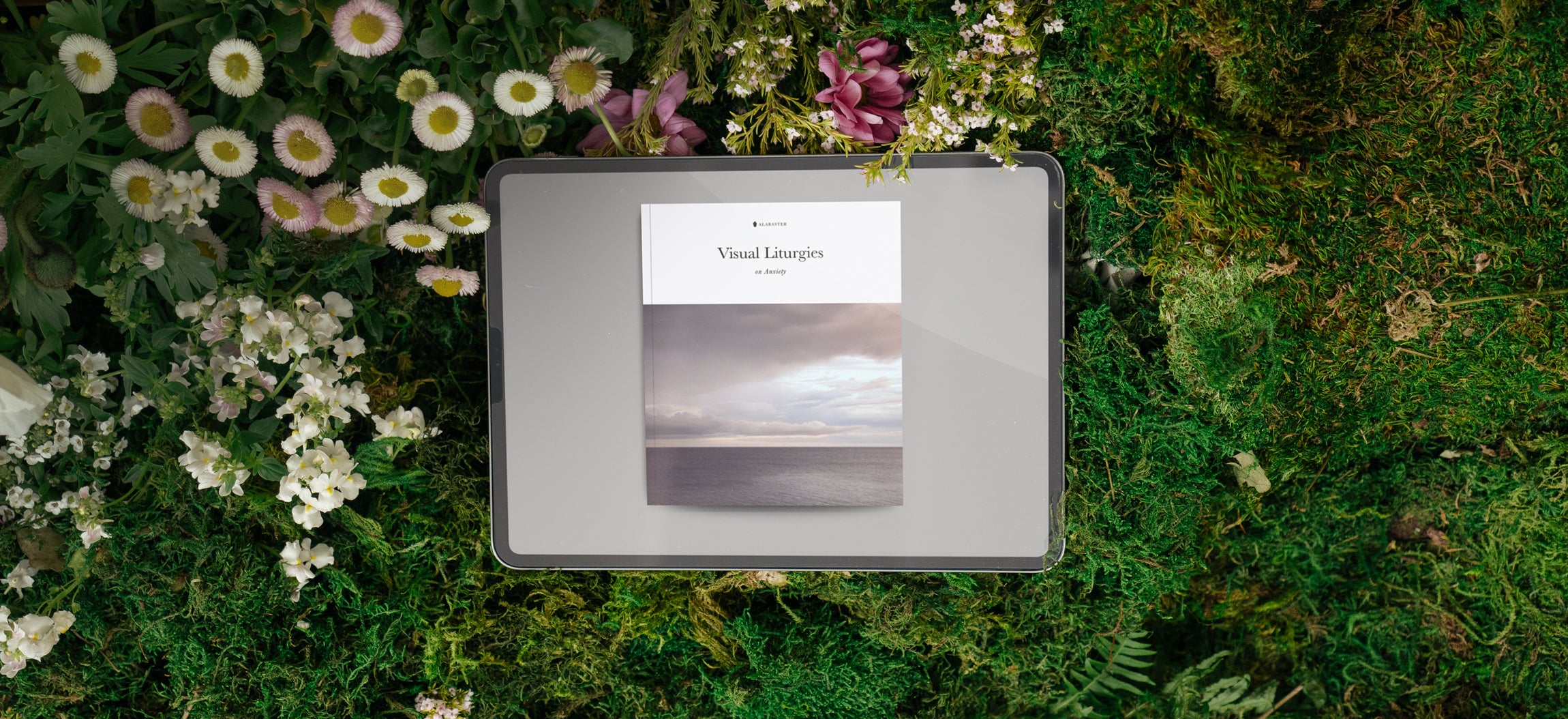 Alabaster E-book in a green setting
